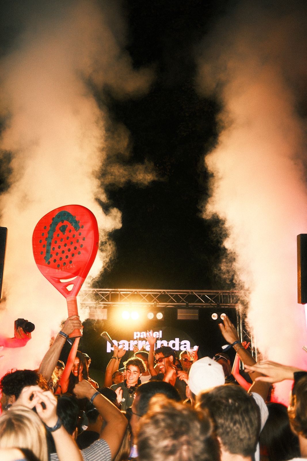 DJ in Munich raising a racquet in the smoke